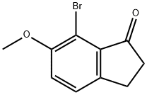 7-ブロモ-6-メトキシ-2,3-ジヒドロ-1H-インデン-1-オン 化学構造式