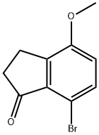 7-ブロモ-4-メトキシ-2,3-ジヒドロ-1H-インデン-1-オン 化学構造式