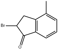 2-BROMO-2,3-DIHYDRO-4-METHYL-1H-INDEN-1-ONE|